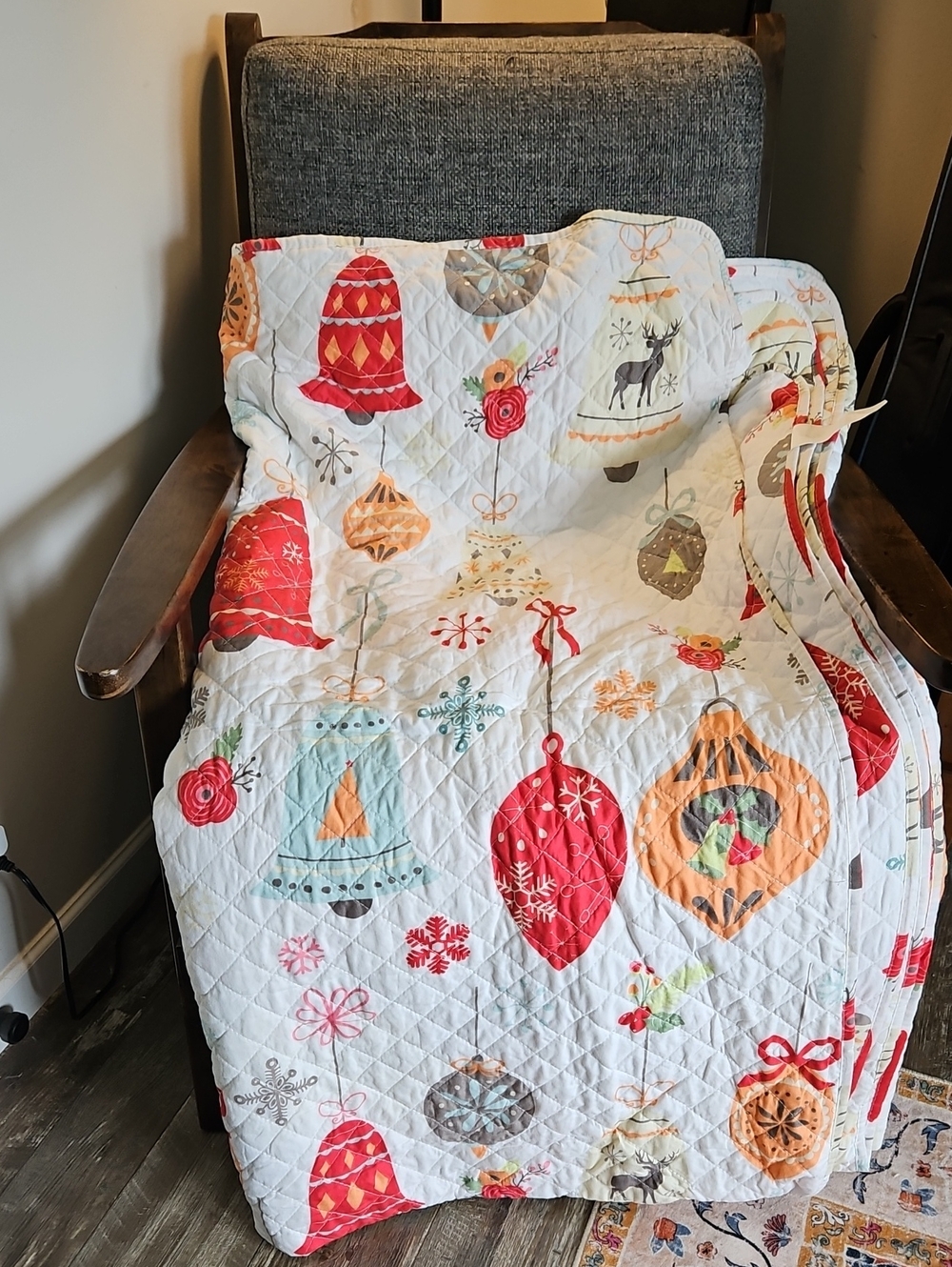 Festive Quilted Holiday Throw Blanket in White with Red & Orange Ornaments